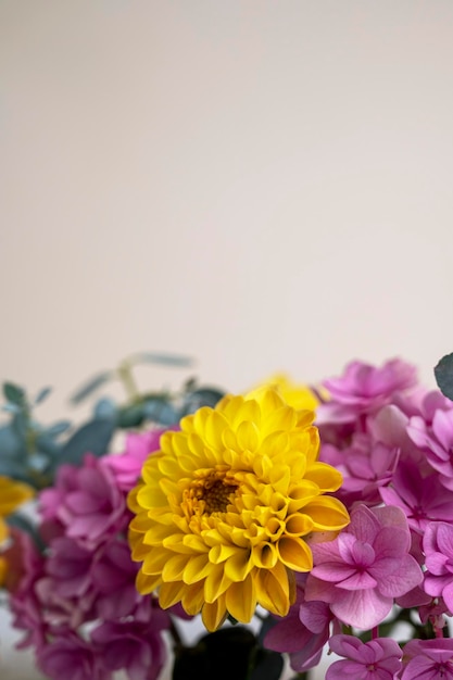 Floral composition greeting card mock up Pink and yellow flowers with copy space Hydrangea dahlias and eucalyptus