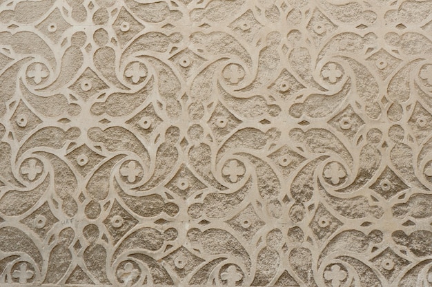 Floral finishing in sgraffito technique on building outside in Segovia Spain Oriental grey ornate