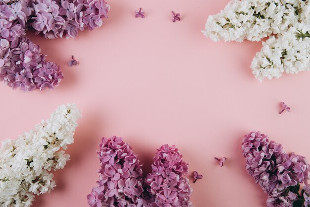 Floral pattern of a branch of lilac on a pink background