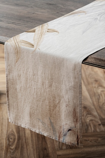 Photo floral table runner on a wooden table