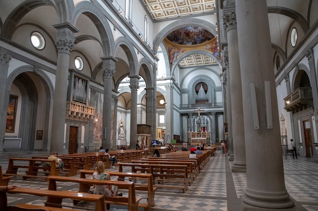 Florence, Italy - June 24, 2018: Panoramic view of interior of Basilica di San Lorenzo (Basilica of St Lawrence) is one of the largest churches of Florence, Italy