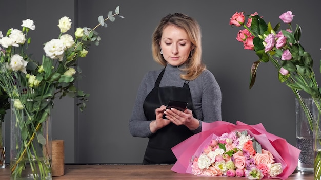 Florist accepts orders for flower bouquets via mobile phone