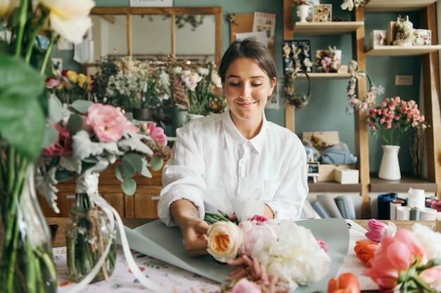 Florist arranging a bouquet of flower