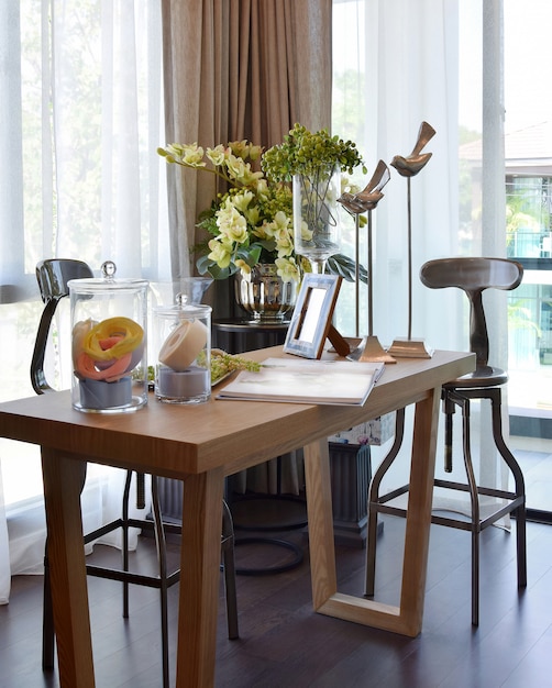 Florist at home. flowers and accessories on wooden table