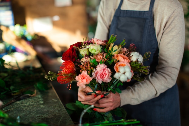 florist makes a bouquet