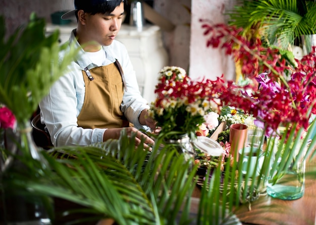 Florist making a flower arrangement in a flower shop