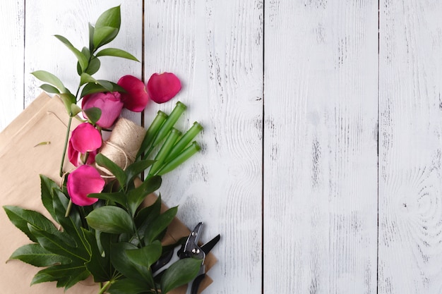 Florist on white wooden table with copy space