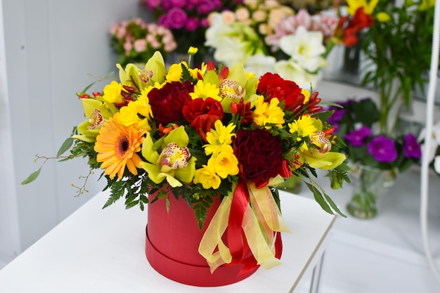 floristic flower arrangement on the table Fresh flowers in a box flower delivery