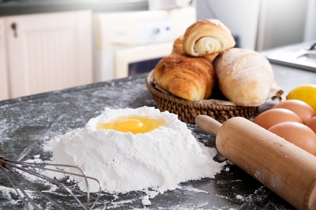 Flour, eggs and ingredients at kitchen