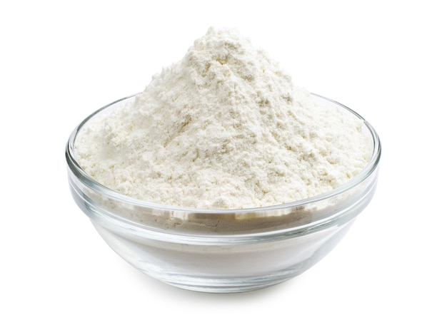 Flour in glass bowl on a white background