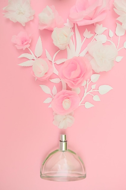 Flower arrangement. Flowers, fragrance perfume on pink background