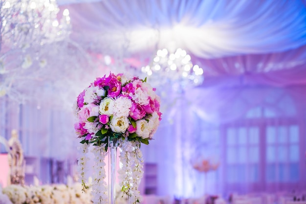 Flower arrangement at a wedding banquet in a restaurant in neon colors