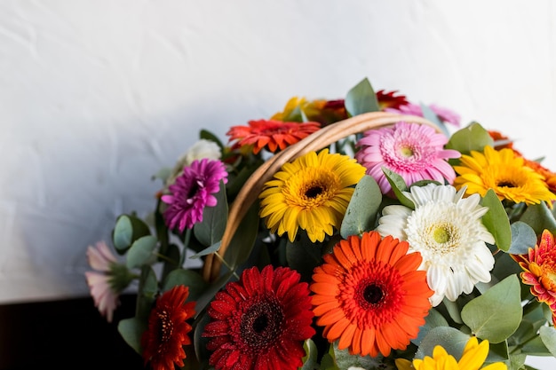 Flower arrangement with colorful daisies in basketBeautiful gerbera flower basketBeautiful flowers bouquet with gerberas