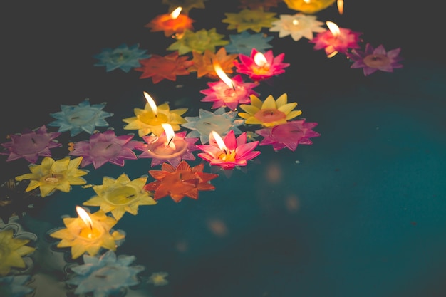 flower-shaped candle burning in the pool of spirit at chinese temple