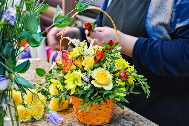 Flower shop. creation of a decorative flower arrangement.