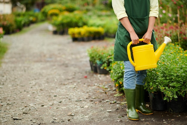 Flower Shop Worker Holding Watering Pot