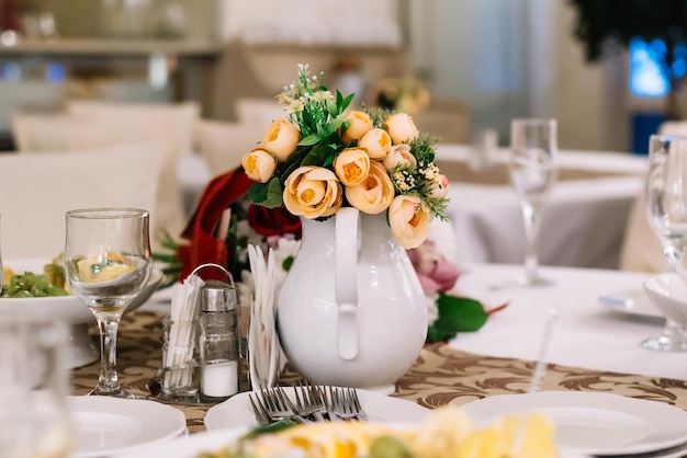 Flower vase on table