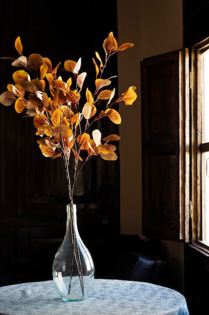 A flowers bouquet in a crystal vase with sunlight