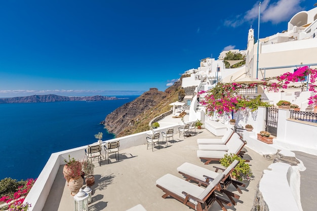 Flowers caldera, sea white village of Oia on the island of Santorini, Greece. Mediterranean travel