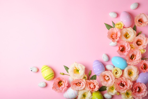 Flowers and easter eggs on a colored background closeup easter background