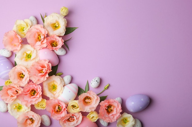 Flowers and easter eggs on a colored background closeup easter background