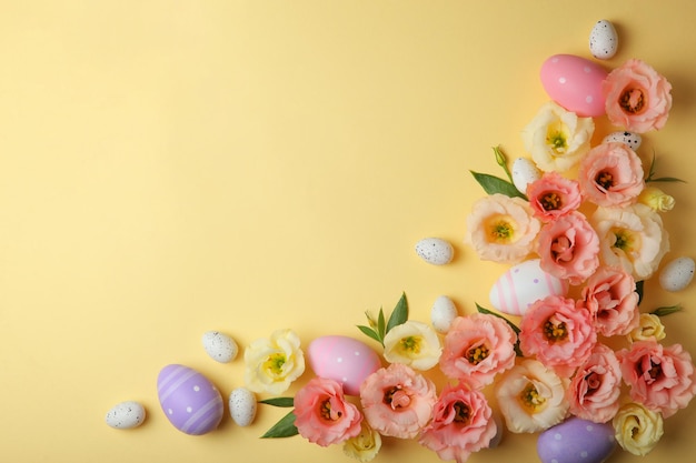 Flowers and easter eggs on a colored background closeup easter background