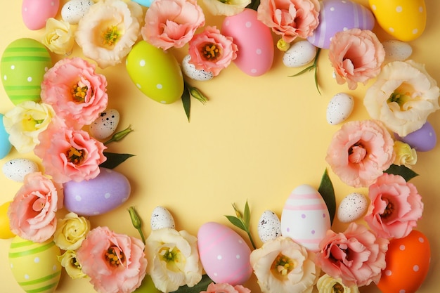 Flowers and Easter eggs on a colored background closeup with a place for text Easter background High quality photo