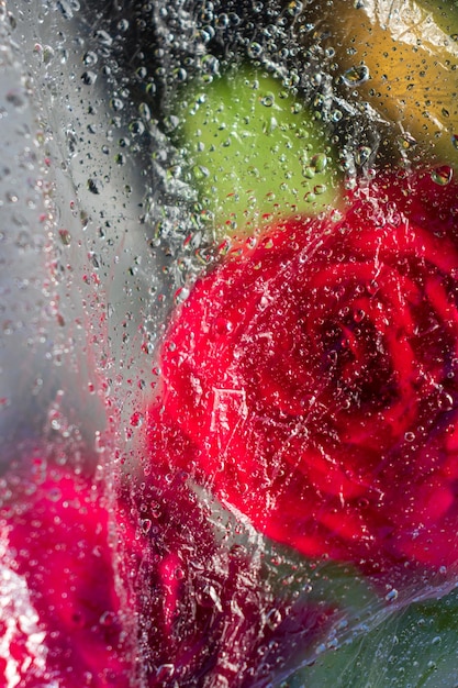 Flowers under a film with water dropsa background image or a screensaver