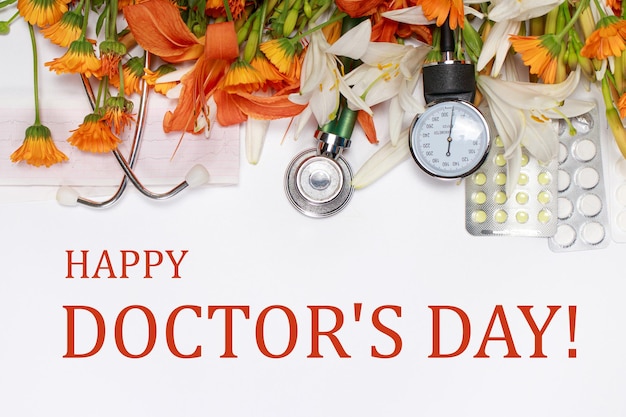 Photo flowers and medical devices with the text happy doctor's day