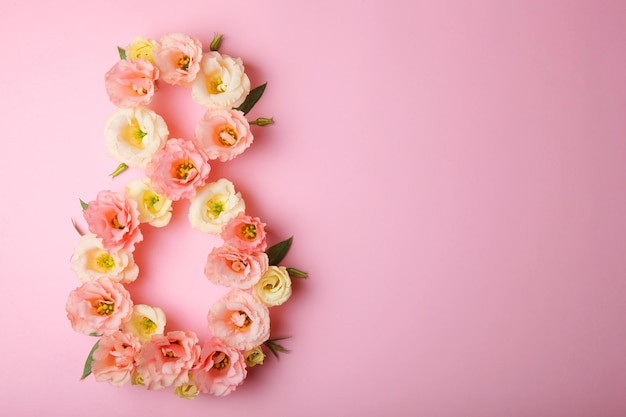 Flowers in the shape of number  on a colored background with place for text