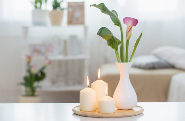 Flowers in vase on white table indoor