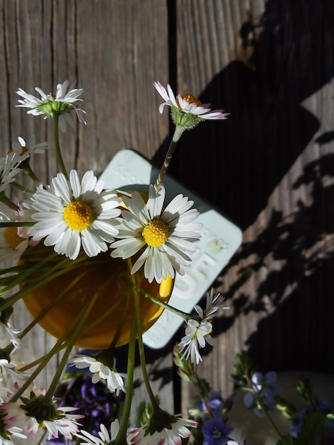 Flowers in yellow vase countryside lifestyle