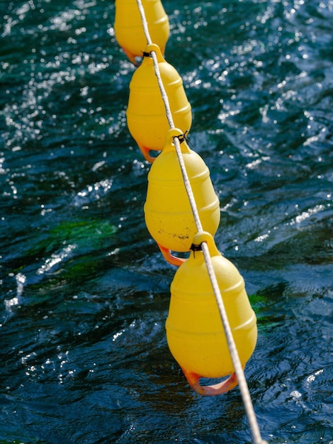 A flowing river and yellow buoy