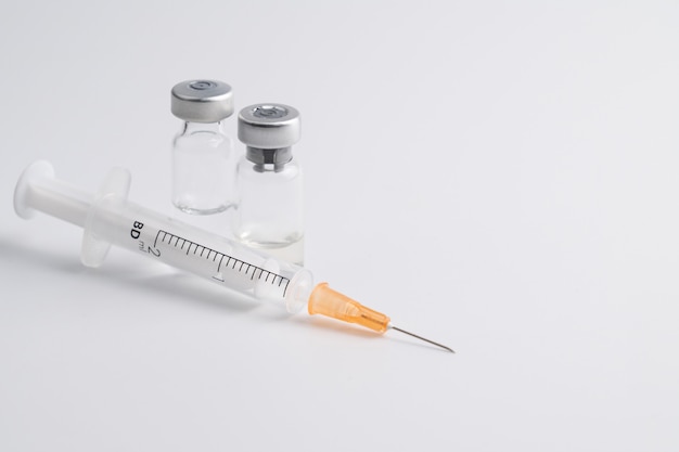 Flu and measles vaccine bottle with syringe injection for vaccination 