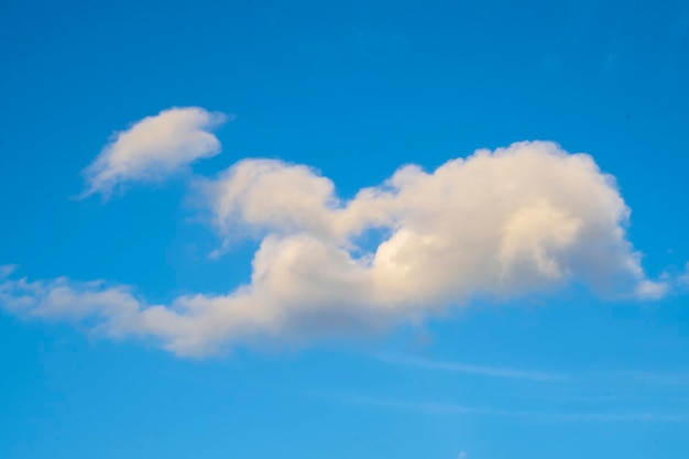 Fluffy cloudy above summer sky background