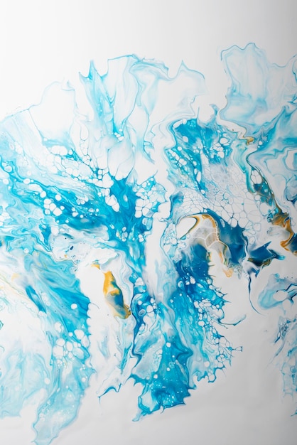 Fluid acrylic painting in blue and gold colors