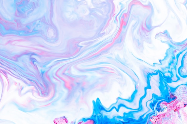 Fluid art. Abstract lilac pink background. Liquid marble texture design. Blue pink pattern Blue-pink pattern with liquid material