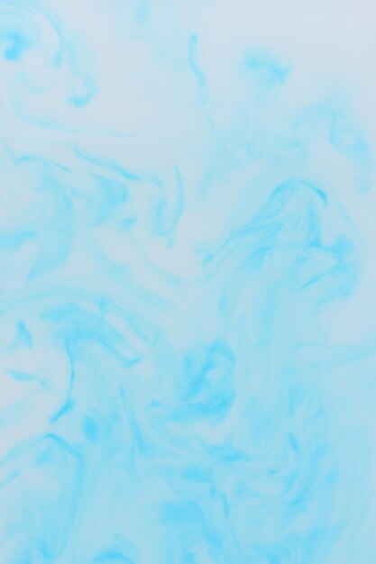 Fluid art Blue stains on a white background Abstract marble texture Liquid color backdrop