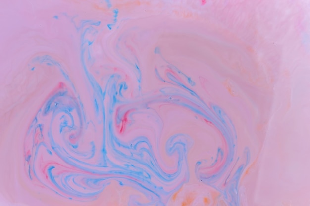 Fluid art Creative multicolored background with abstract painted waves Mixed paints Marble beautiful pattern