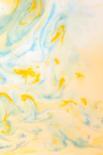 Fluid Art Yellow blue abstract background Blue yellow pattern of paints on liquid