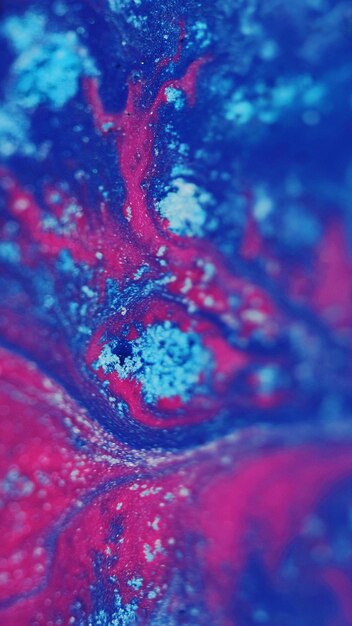 Fluid paint background wet ink texture blue pink