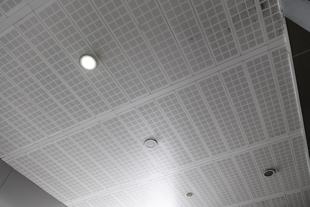 Fluorescent lamps on the modern ceiling