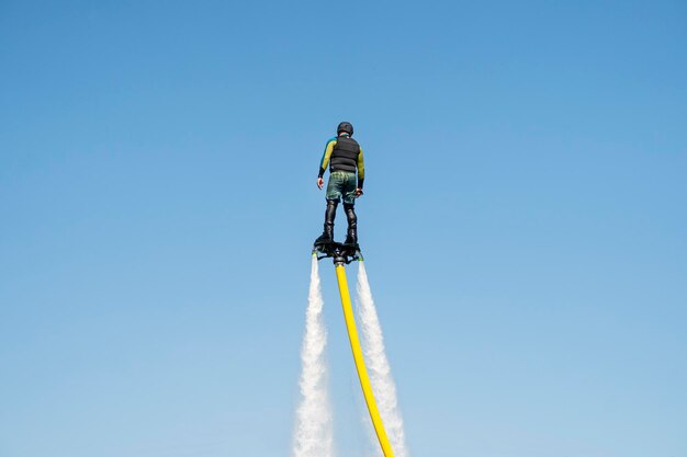 Flyboard Air Farthest flight by hoverboard Flyboard is aerial machine for personal watercraft allows propulsion underwater Man flying on Board