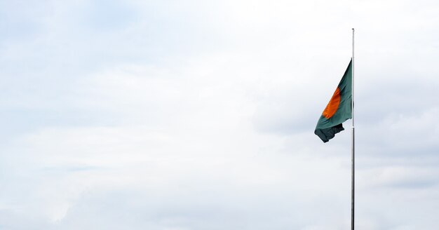 Flying bangladesh national flag under the clean sky with copy spac