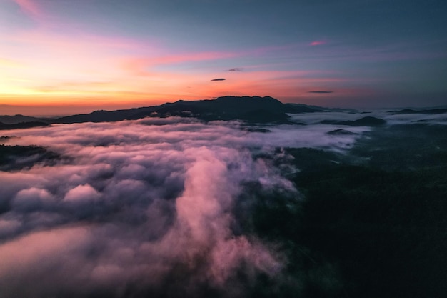 Flying above the clouds sunrise and fog,on the hill