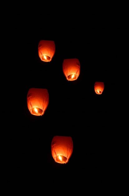 Flying lantern in the dark sky