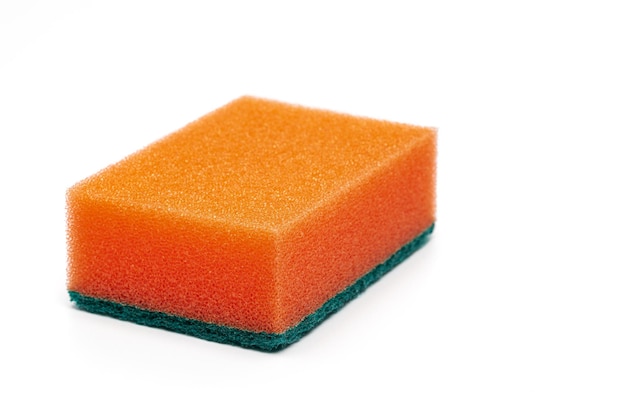 Foam sponge of orange color with abrasive material used daily by all housewives to clean house white...