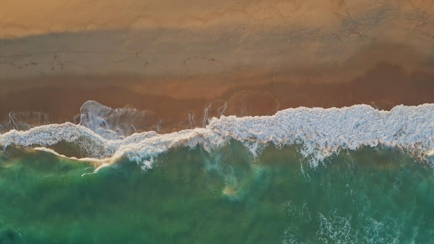 Foamy marine sand beach at summer weekend aerial view white sea waves coastline