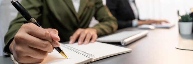 Focus closeup office worker's hand taking notes or writing Prodigy