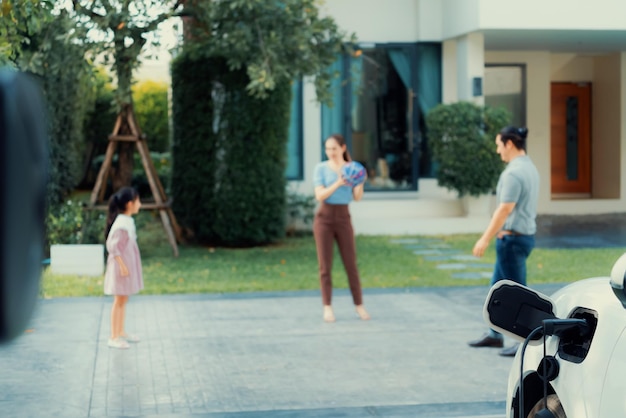 Focus home charging station for EV car blur progressive family in background